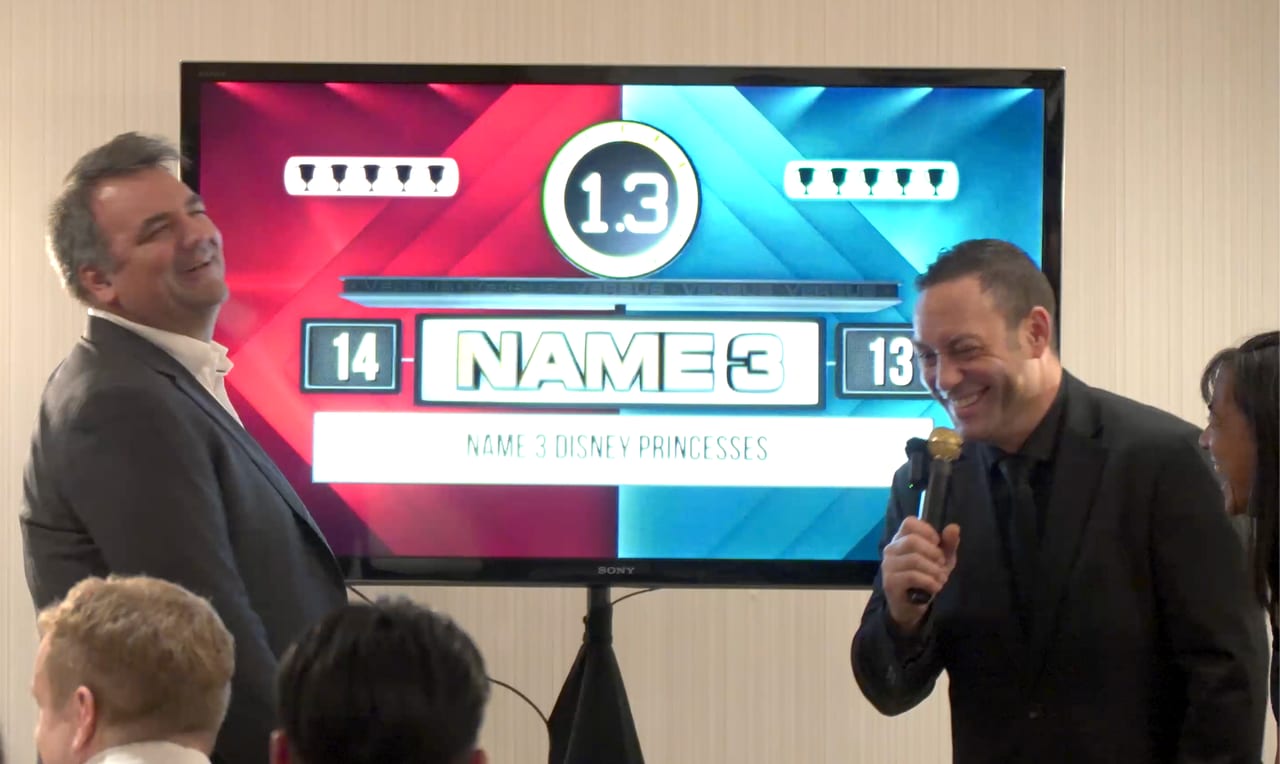 A Viva Funcouver host on the mic running a live game round